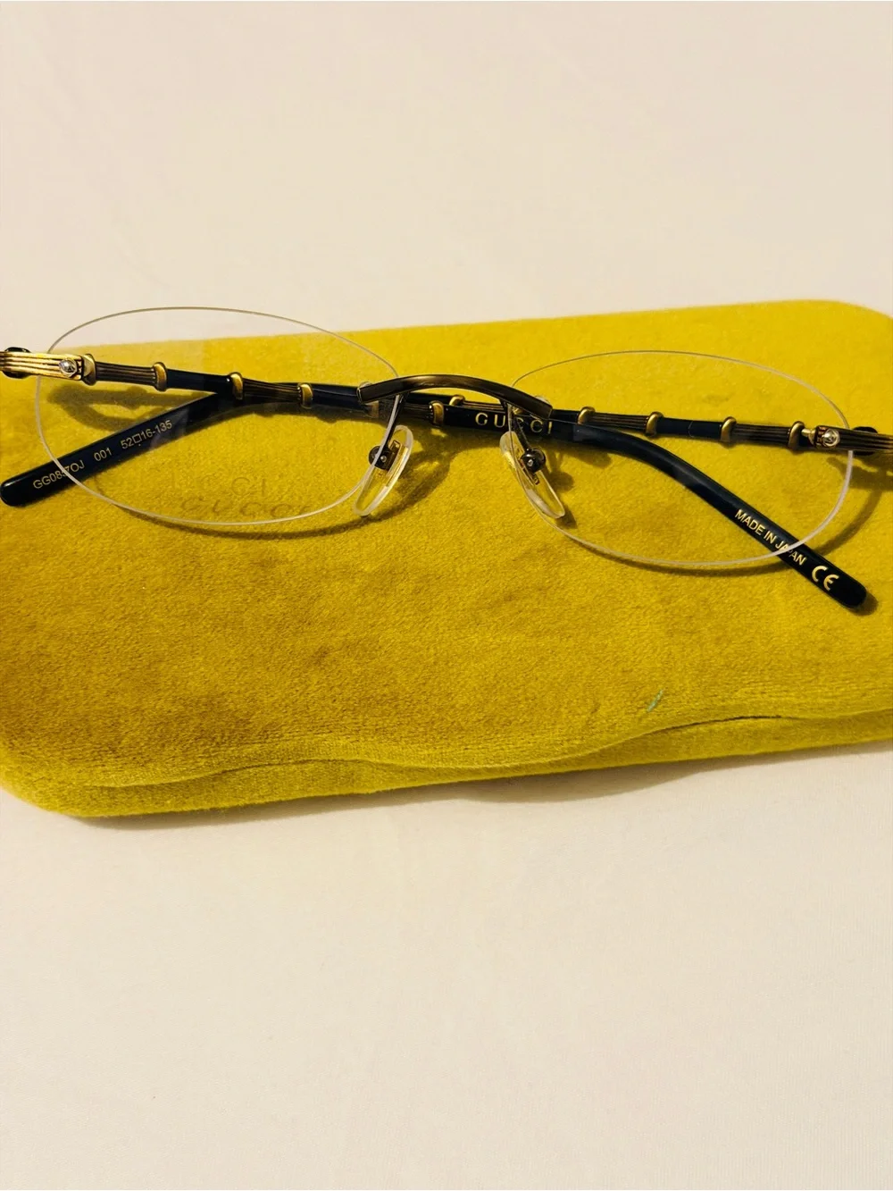 Gucci Rimless Men's Glasses in Black and Gold Accents